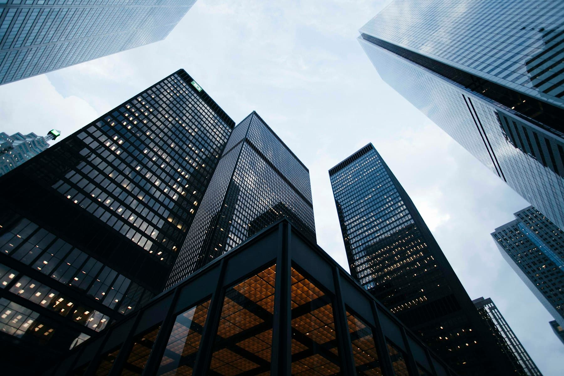 Glass commercial towers photographed from street level